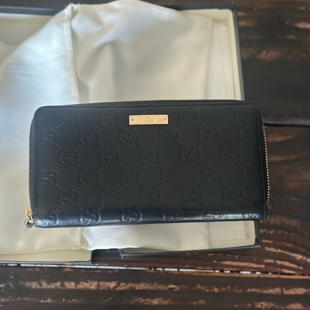 Gucci Black Embossed GG Zip Wallet with Gold Plaque